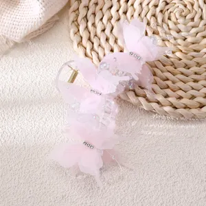 Pink butterfly hair claw clip detail, mesh bow design with rhinestones and pearls for women updos.