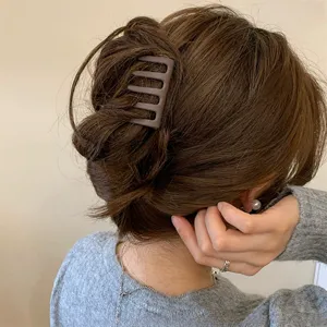 Minimalist chocolate brown hair claw clip, elegant matte hair catch for chic daily updos.