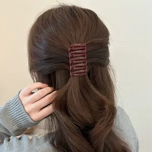 Chocolate brown hair claw clip, minimalist cross hair accessory for stylish fall winter styling.