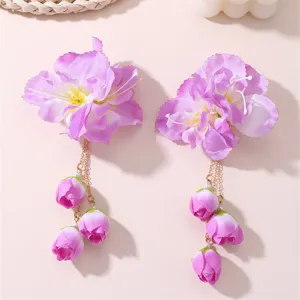 Detail shot of purple fabric flower hair clips with hanging bud chains, ideal for Hanfu.