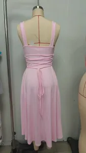 Elegant solid color strappy maxi dress with back tie design, perfect for summer fashion.