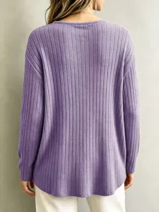 Detailed view showing the back of a casual loose ribbed long-sleeve purple knit sweater top.