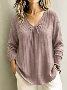 Casual solid color V-neck long sleeve ribbed knit sweater top for women, comfortable fit.