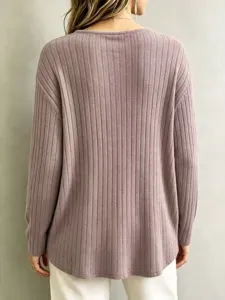 Detailed view of women's casual loose ribbed knit long sleeve sweater back design.