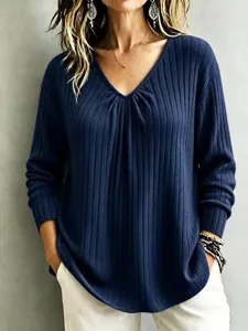 Detail view of the stylish ribbed V-neck long sleeve top in navy blue, comfortable fit.
