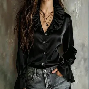 Detail shot of women black satin blouse featuring chic ruffle v-neck and elegant flare sleeves.