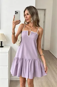 Elegant lavender spaghetti strap mini dress with scalloped V-neck and ruffled hem.