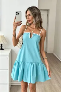 Elegant light blue cami mini dress with white scalloped trim and tiered ruffle hem details.