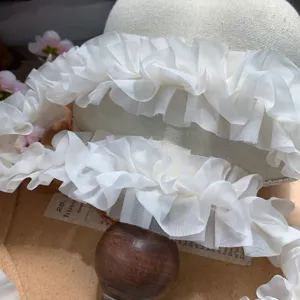 Detail view of 5cm off white chiffon pleated lace trim, perfect for DIY sewing and crafts.