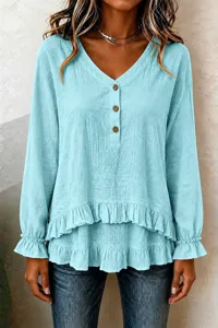 Light blue long sleeve V-neck blouse with ruffled layered hem and buttons for women.