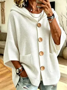 Womens casual solid color waffle knit hooded cardigan with front buttons and pockets.