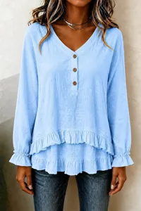 Light blue long sleeve ruffle V-neck blouse detail, showcasing unique layered hem design.