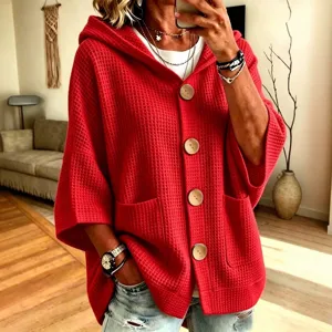 Women's solid color waffle knit hooded cardigan with front buttons, casual outerwear.