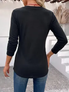 Women's casual solid black long sleeve top slim fit basic shirt paired with blue jeans.