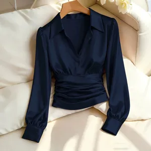Elegant dark blue satin lapel blouse with gathered waist and long sleeves for women.