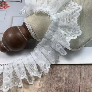 White pleated lace trim detail shot, 5cm wide heart ruffle fabric DIY sewing accessory.