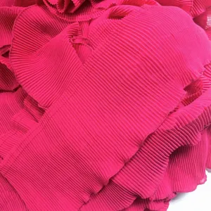 Close up of hot pink pleated chiffon fabric trim, soft accordion pleat detail for sewing.