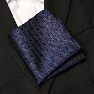 Dark blue striped pocket square detail shot, elegant formal accessory for men's suit jacket.
