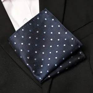 Men's blue polka dot pocket square detail, elegant formal suit accessory and chest handkerchief.