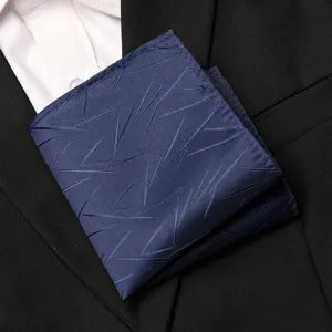 Men's navy blue patterned pocket square suit handkerchief detail view for formal wear.