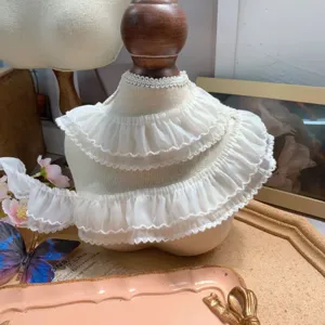 Close-up detail of white double-layer chiffon dogtooth lace trim for DIY apparel crafts.