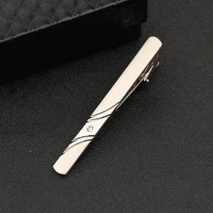 Silver metal tie clip for men with elegant engraved lines and sparkling crystal stone detail.