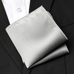 Silver ribbed pocket square detail, elegant men formal suit accessory, premium textile.