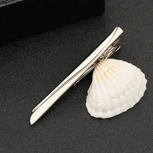 Silver metal tie clip detail view, minimalist design for business men and formal wear styling.