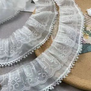 Detailed view of 7cm double layer white chiffon lace trim with delicate pearls for DIY crafts.