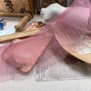 Detail shot of 12cm pink pleated mesh lace trim, ideal for crafts and diy doll clothes.