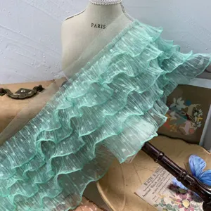 Detailed view of mint green 5-layer polka dot mesh ruffle lace trim for DIY crafts.