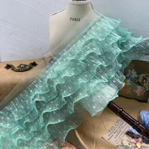 Light green ruffled dotted lace trim fabric for DIY sewing crafts and dress decoration.