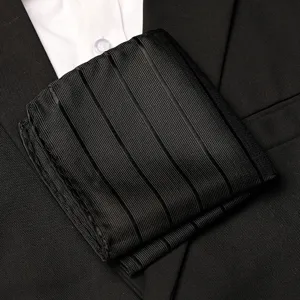 Detailed view of men's black striped pocket square, elegant fabric texture for formal suit styling.