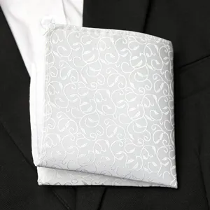 Men's pocket square detail closeup, white floral pattern pocket handkerchief for suit.