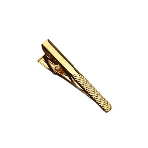 Classic gold-tone men's tie clip with textured mesh pattern for formal business wear.
