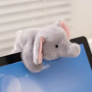 Cute grey elephant plush toy hanging on laptop screen soft stuffed animal desk companion