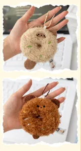 Close up detail view of cute plush donut animal keychain pendant, soft fabric, cute design.