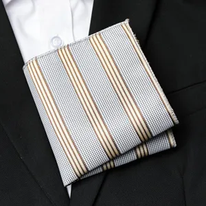 Detailed view of men's pocket square featuring blue mesh texture and brown striped pattern for suits.