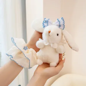 Cute plush rabbit keychain and bag charm featuring a sweet bow and pearl chain for girls.