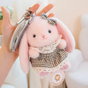 Close-up detail of the cute pink plush bunny rabbit pendant with a plaid dress and key ring.