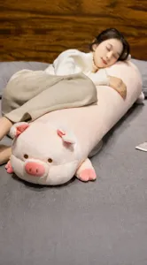 Cute pink pig long plush body pillow for sleeping and relaxing, comfortable bedroom decor.