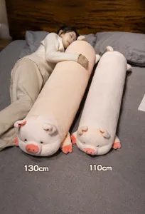 Detail view of the cute pink pig long plush body pillow, soft stuffed toy for cozy bedroom.