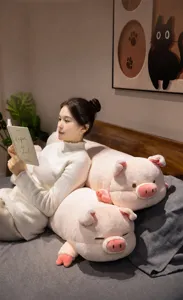 Soft pink pig plush long pillow bedside cushion and cozy body pillow for bedroom comfort.