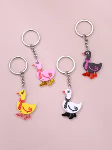Porte-clés en acrylique canard de dessin animé mignon avec bottes de paillettes et écharpe.