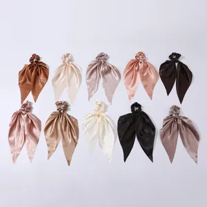 Set of 10 satin hair scrunchies with long ribbons, solid colors in elegant brown and pink tones.