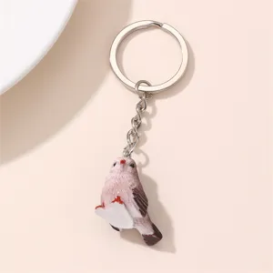 Détail de porte-clés oiseau rose mignon, pendentif animal délicat avec anneau métal