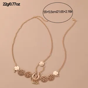 Gold boho forehead chain with hollow flower pendants, ethnic brow piece for costume party.