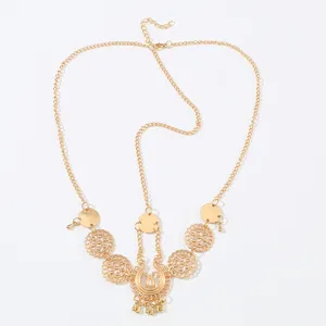 Vintage gold boho forehead chain detail, intricate hollow flower brow pendant and dainty link.