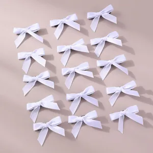 Detailed close-up view of the cute white ribbon bow hair clips in a 15-piece set.