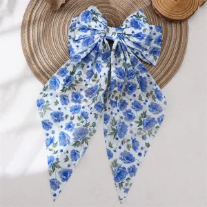 Blue floral chiffon bow hair clip detail, elegant spring hair accessory for women updo.